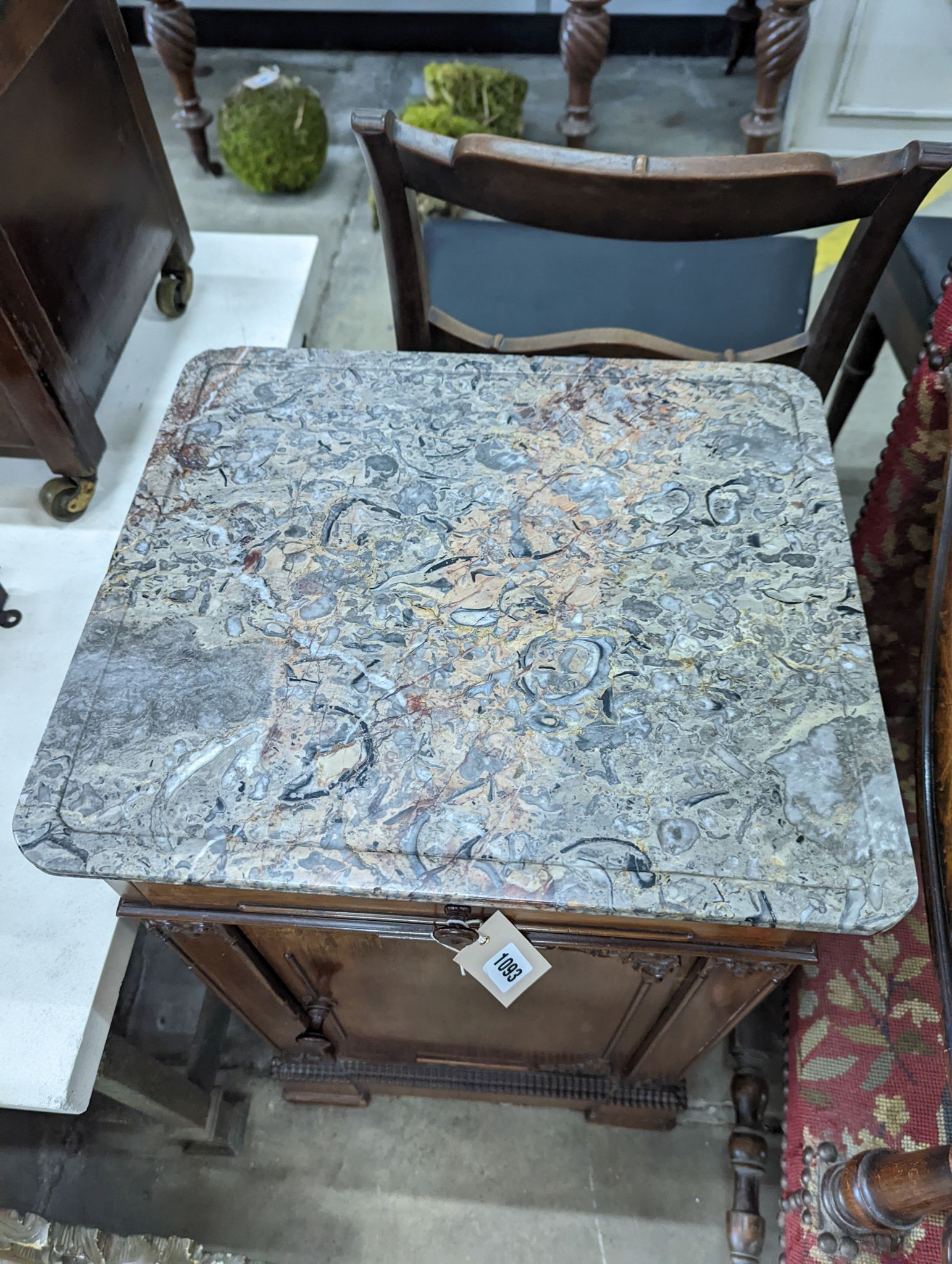 A 19th century fossil stone topped bedside table, width 42cm, depth 38cm, height 75cm